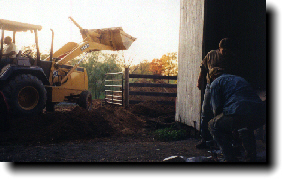 Digging a hole by the barn for the concret holding tank.